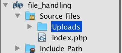 The NetBeans Projects panel: the project file_handling contains Source Files with a folder named Uploads (selected) and the file index.php, and below it Include Path.