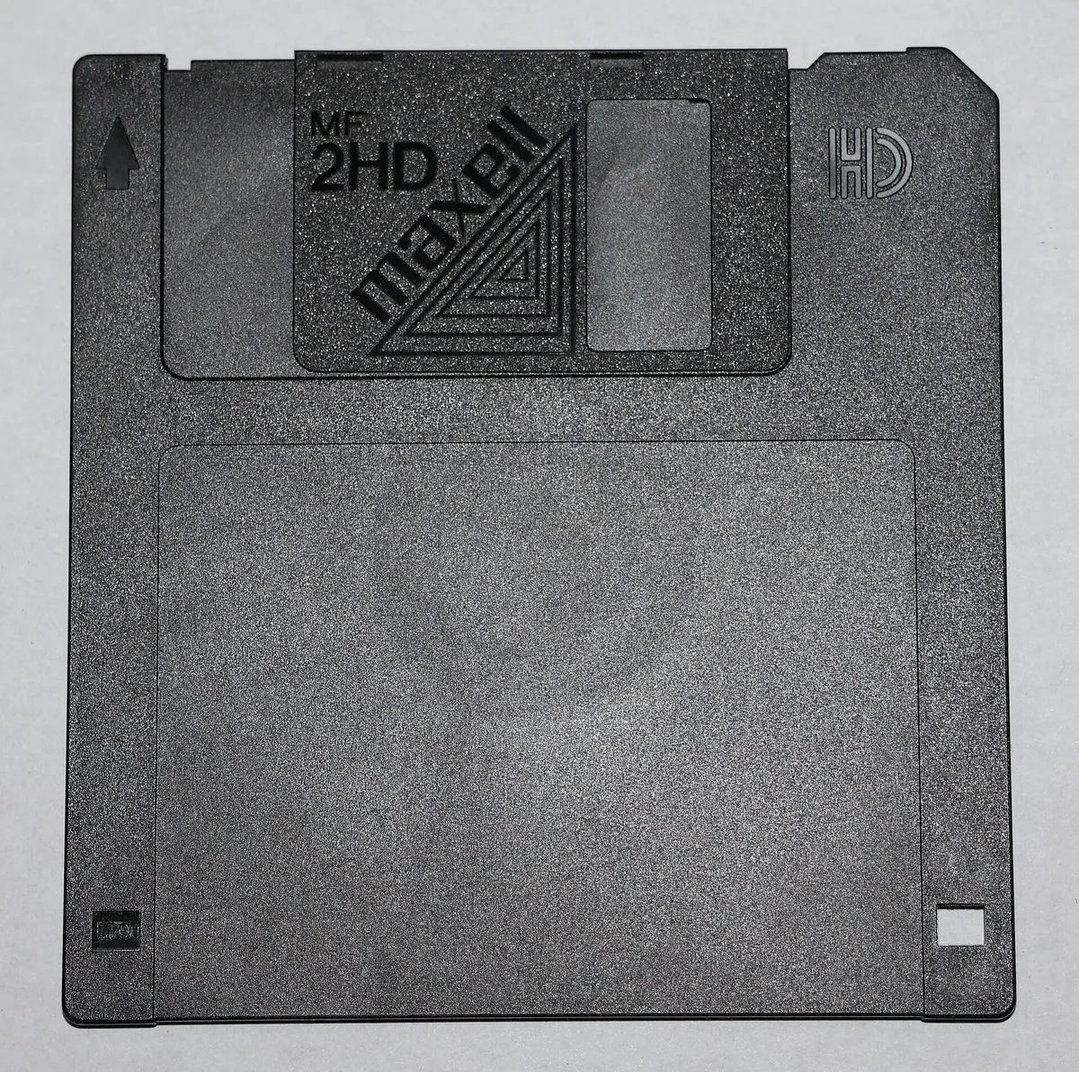 A grey 3.5-inch floppy disk with a sliding shutter and the letters HD.